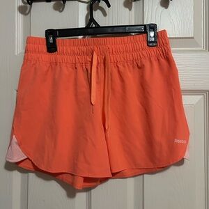 Reebok Women's Bright Orange Athletic Shorts